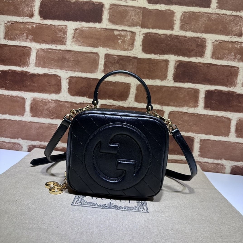 G*u*i top handle bags
